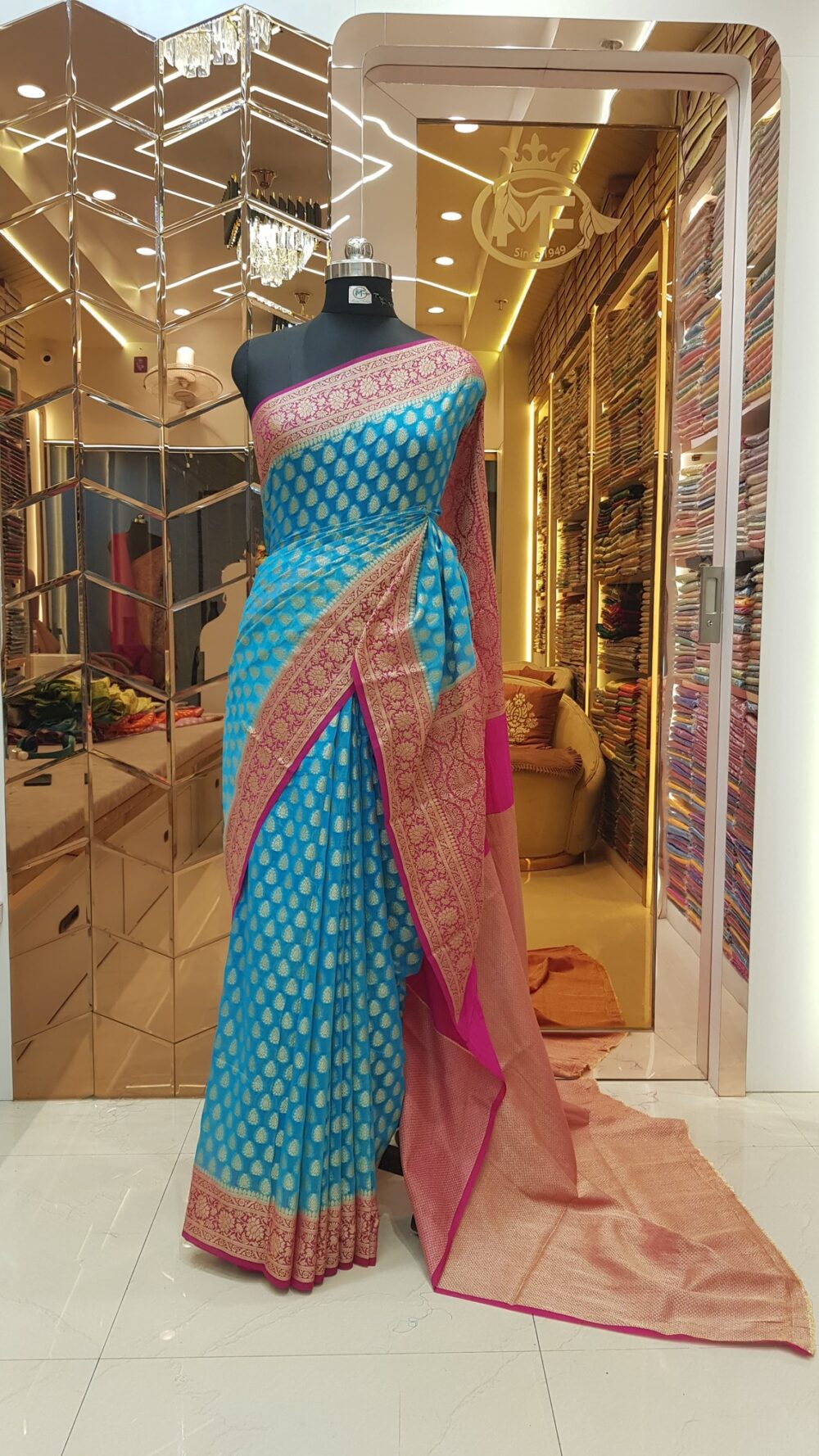 MOINI FABRICS - Banarasi Georgette Contrast Border Saree.